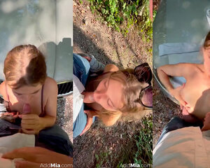 Mia Melano gives her friend a blowjob on a dirt road